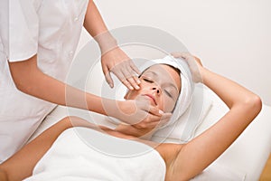 Body care - woman at face massage