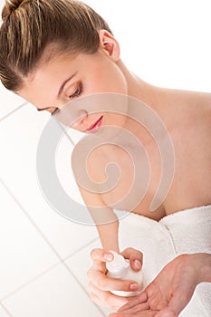 Body care - Young woman apply lotion
