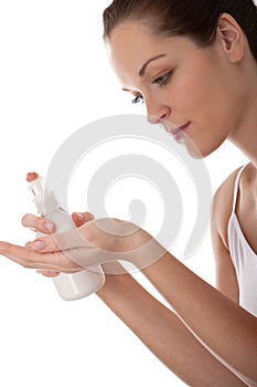 Body care - Young woman with lotion