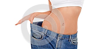 Body, health and woman with big pants in studio for weight loss, fitness or exercise results. Wellness, diet and closeup