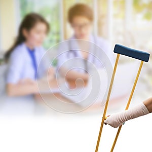 Body injury concept, arm pain and broken with wooden crutches is