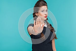 Body language, bad emotion. Serious woman showing stop sign at c