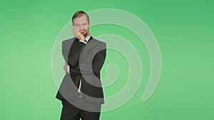 Body language. a man in a business suit on a green background. hromakey,