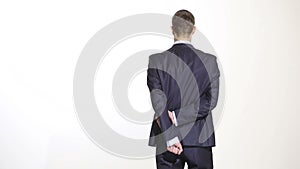 Body language. man in business suit isolated white background. Training managers. sales agents. hands behind his back