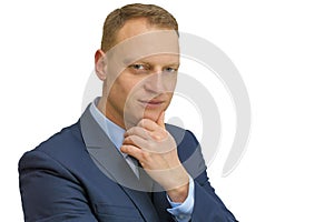 Body language. man in business suit stroking the chin isolated on white background