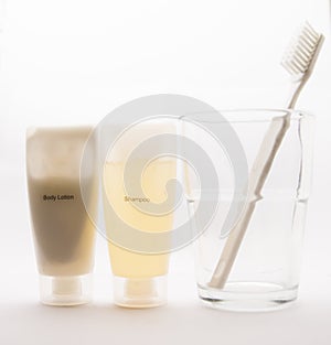 Body Lotion,Shampoo and teeth brush on background