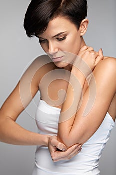 Body Pain. Beautiful Woman Feeling Pain In Elbows, Painful Arm