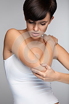 Body Pain. Beautiful Woman Feeling Pain In Elbows, Painful Arm