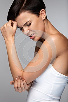 Body Pain. Beautiful Woman Feeling Pain In Elbows, Painful Arm