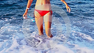 Body part of young woman in snorkeling gear sea wae