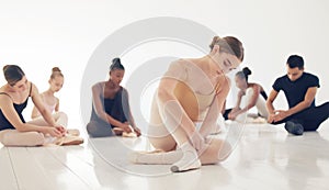 The body says what words cannot. a group of young ballerinas preparing for their routine.