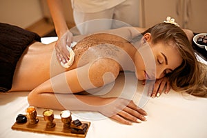 Body Scrub. Beautiful Blonde Gets a Salt Scrub Beauty Treatment