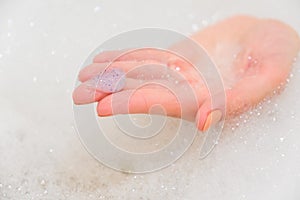 Body scrub with exfoliating particles. Selective focus. Closeup