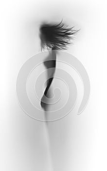 Body silhouette of a beautiful slim woman with long flying hair, abstract.