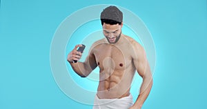 Body, spray and man with deodorant and perfume for cosmetic, hygiene and clean smell on blue background in studio