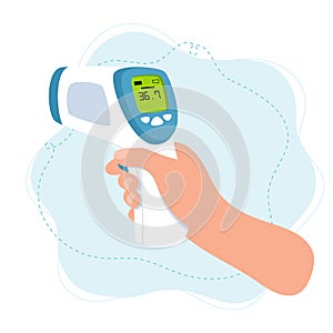 Body temperature check, hand holding infrared thermometer.