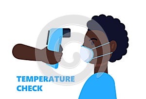 Body temperature check is required. Non-contact thermometer in hand. Black man is wearing mask on the face. Coronavirus prevention
