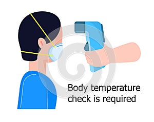 Body temperature check is required. Non-contact thermometer in hand. Human is wearing mask on the face. Coronavirus prevention and