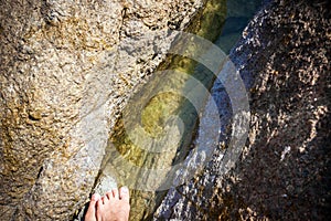 Body of water between gentle colored stones