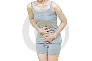 The body of a woman in gray clothes put her hands on the Stomach area at spot of ache, abdominal pain, Health-care concept on