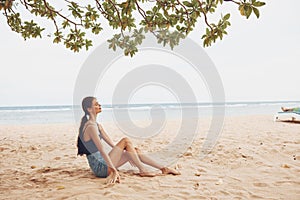 body woman sea beach sand sitting smile travel nature vacation freedom