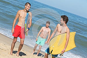 bodyboard men on beach