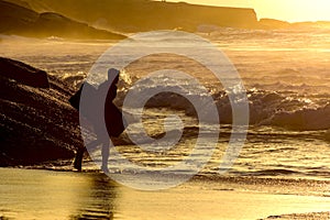 Bodyboarder going into the water