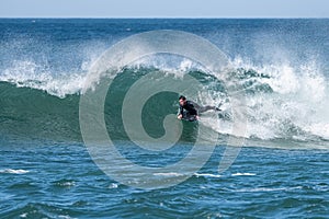 Bodyboarder surfing ocean wave