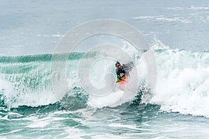 Bodyboarder surfing ocean wave