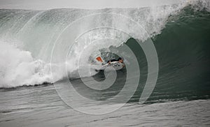 Bodyboarder in the tunnel