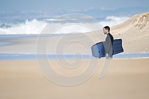 Bodyboarder watching the waves