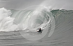 Bodyboarder and wave