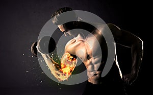 Bodybuilder athlete lifting weight with fire explode arm concept