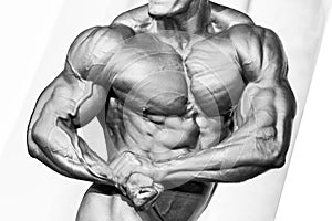 Bodybuilder athlete torso. Black and white photo