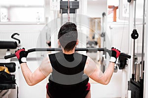 Bodybuilder Doing Heavy Weight Exercise For Back