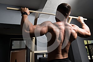 Bodybuilder Doing Pull Ups Best Back Exercises