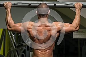 Bodybuilder Doing Pull Ups Best Back Exercises