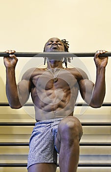 Bodybuilder Doing Pull-Ups in the Gym