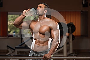 Bodybuilder Drinking Water From Shaker