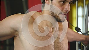 Bodybuilder guy in gym pumping up hands close up