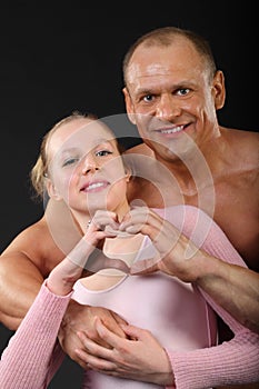 Bodybuilder hugs with girl