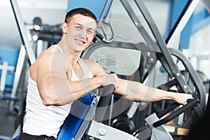 Bodybuilder man doing biceps muscle exercises photo