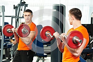 Bodybuilder man doing biceps muscle exercises photo