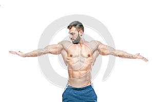 Bodybuilder posing. Beautiful sporty guy male power. Fitness muscled in blue shorts. on isolated white background. Man