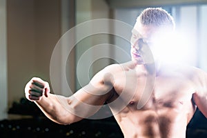 Bodybuilder posing in Gym
