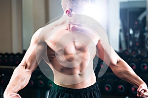 Bodybuilder posing in Gym