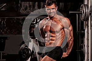 Bodybuilder posing in the gym