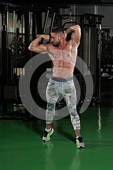 Bodybuilder Posing In The Gym