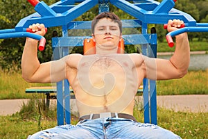 Bodybuilder`s traning outdoor photo