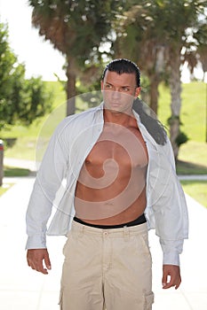 Bodybuilder with shirt unbuttoned photo